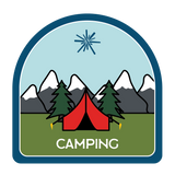 Tent with mountains and trees behind it.