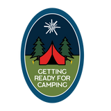 Tent with two trees behind it.