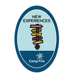Sign with multiple arrows pointing in various directions toward different campsite locations.