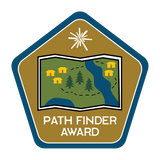 Map with cabins, bodies of water, trees, and various paths / trails.